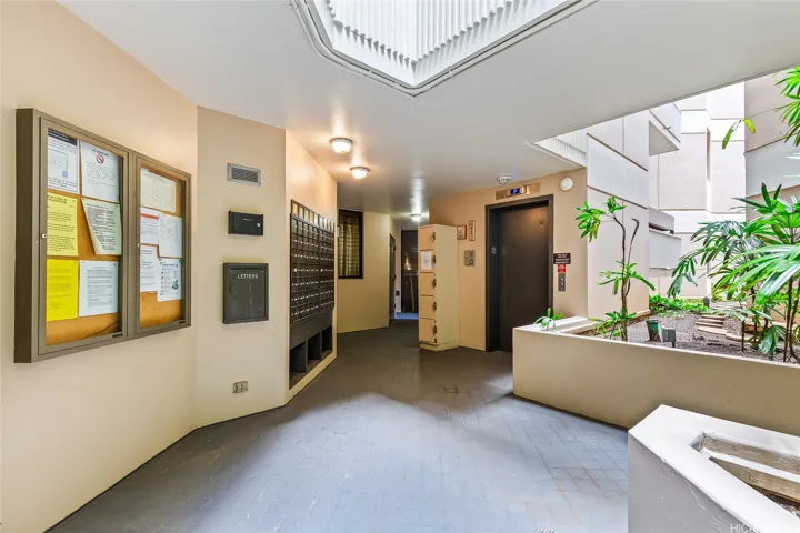 Building lobby with keyed elevator and mailboxes