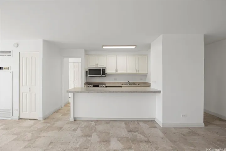 Kitchen with newer appliances, including dishwasher.
