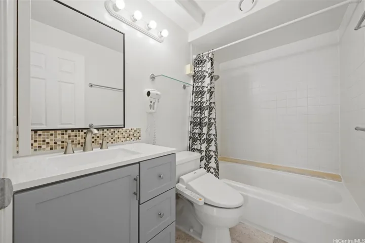 Full bath with newer vanity.