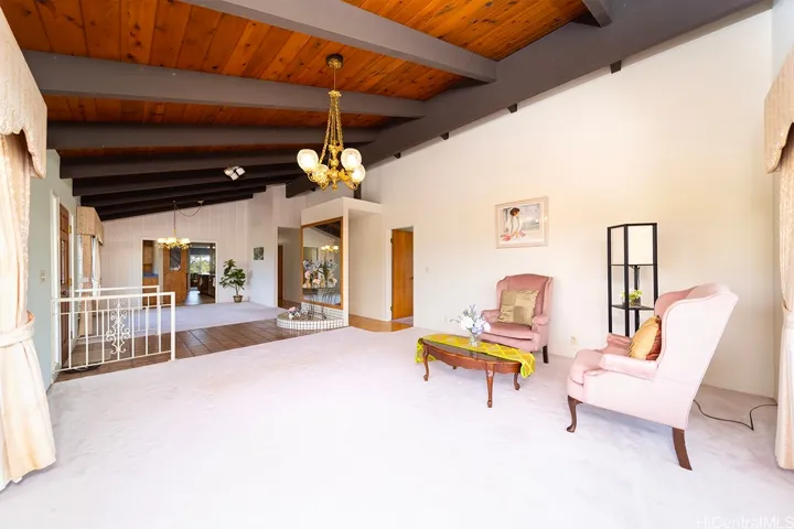Enter to a large vaulted living room.