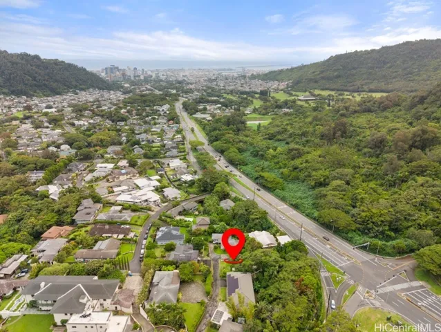 Drone shot of property in relation to downtown and surrounding neighborhood.