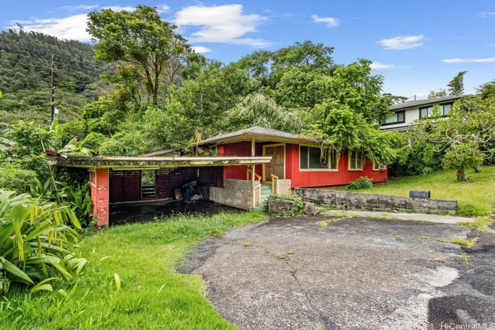 Exterior of the property including carport and front entrance.