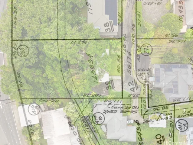 Enhanced – Aerial drone view of the property with the plat map overlaid to illustrate approximate property boundaries.