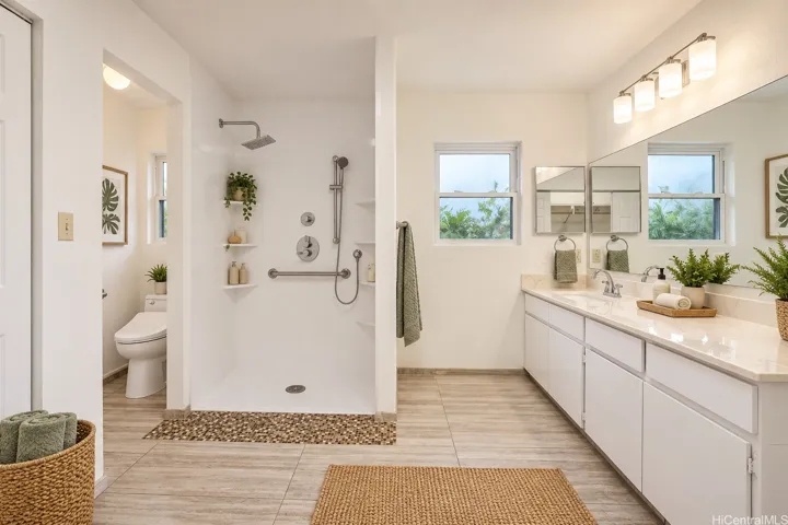 Virtually staged -Spacious primary bath featuring a curbless walk-in shower with accessibility-minded features designed for added ease and convenience.