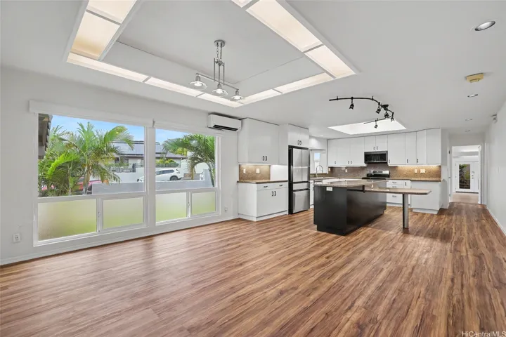 Spacious dining area and kitchen with an open, functional layout and ample counter space.