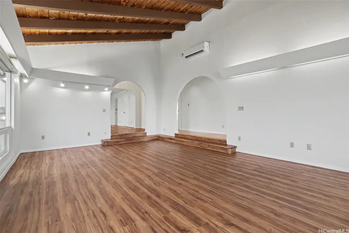 Expansive living room facing the kitchen