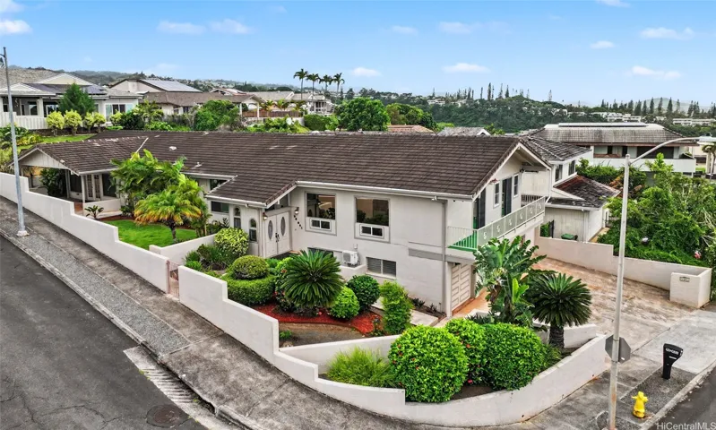 Desirable corner-lot setting in Royal Summit, offering added frontage, an open feel, and a distinctive presence.