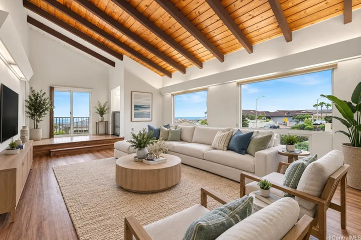 Virtually staged main living room showcasing the spacious layout, abundant natural light, and orientation toward the ocean views..an inviting space for relaxing and entertaining.