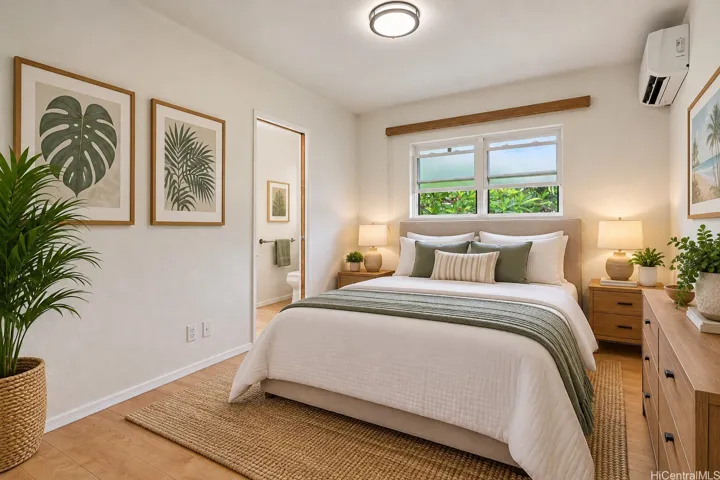 Virtually staged second bedroom featuring split A/C, abundant natural light, and a comfortable, functional layout.