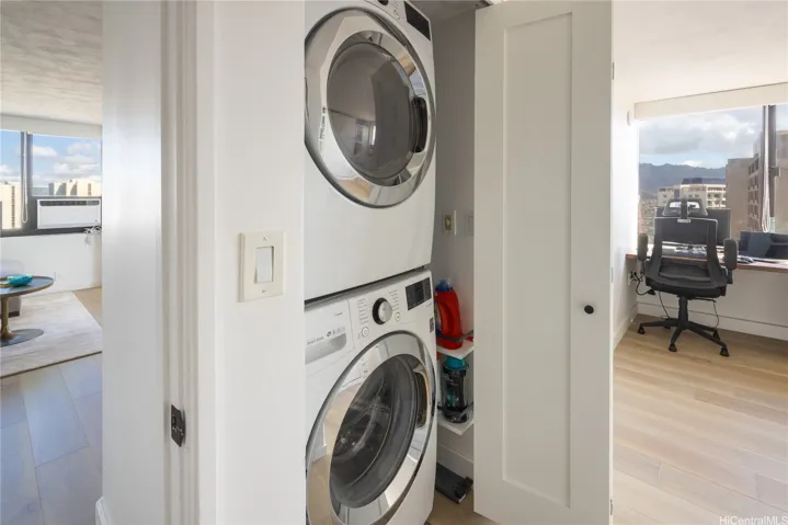Full size washer and dryer with the same closet doors throughout the unit, convenient and thoughtful space shelves for laundry supples.