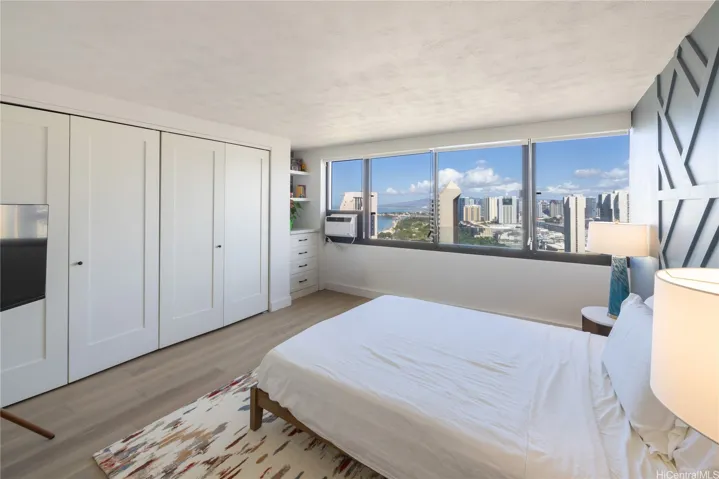 Ocean views of Ala Moana Beach Park.  Custom built ins in large primary with double sink insuite