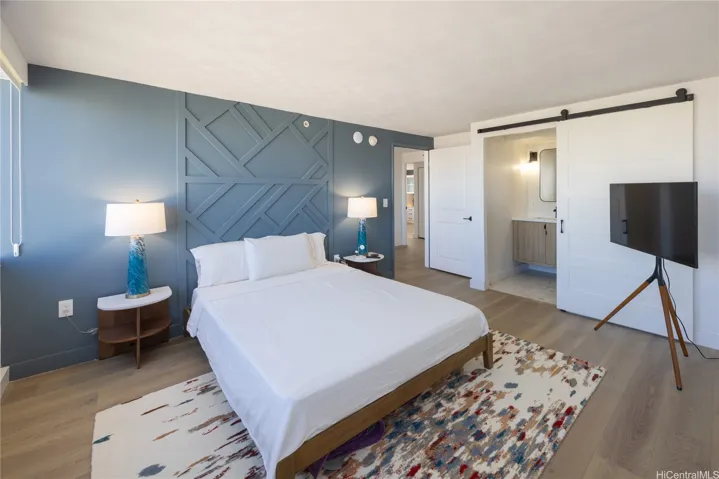 Primary bedroom retreat finished off with a beautiful accent wall.
