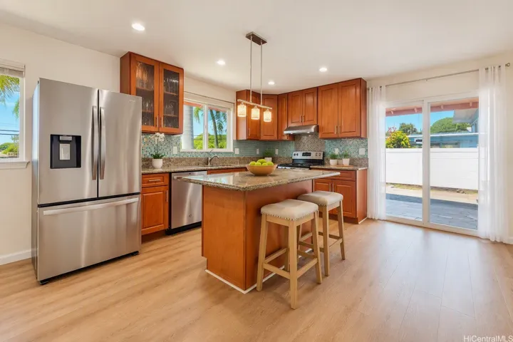 Downstairs kitchen: with new stainless appliances and easy access to the lanai:Enhanced photo