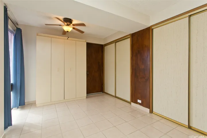 Second bedroom with built in murphy bed, two reach-in closets and a storage closet.