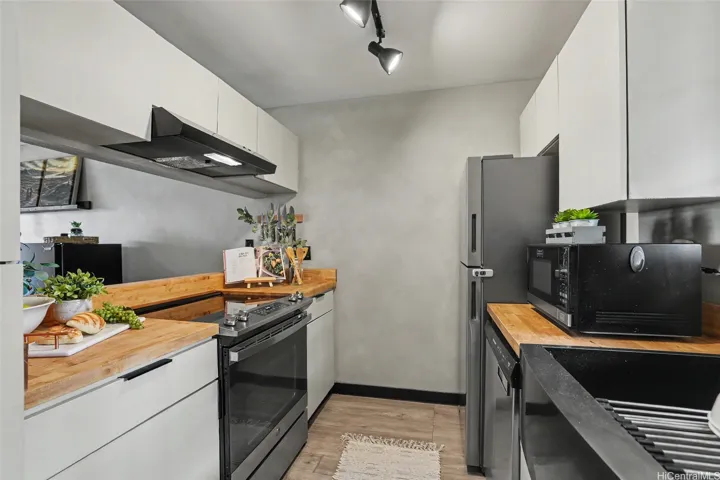 Clean modern kitchen with butcher block countertops!