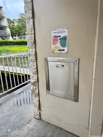 Trash chute just around the corner from the unit