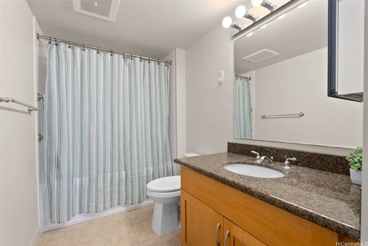 Spacious primary bedroom featuring a private ensuite bathroom for added comfort and convenience.