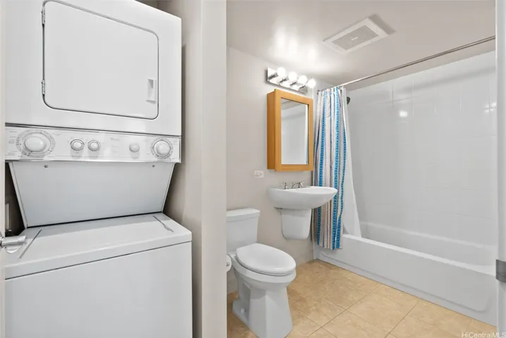 Second full bathroom conveniently located across from the second bedroom, with an in-unit washer and dryer.