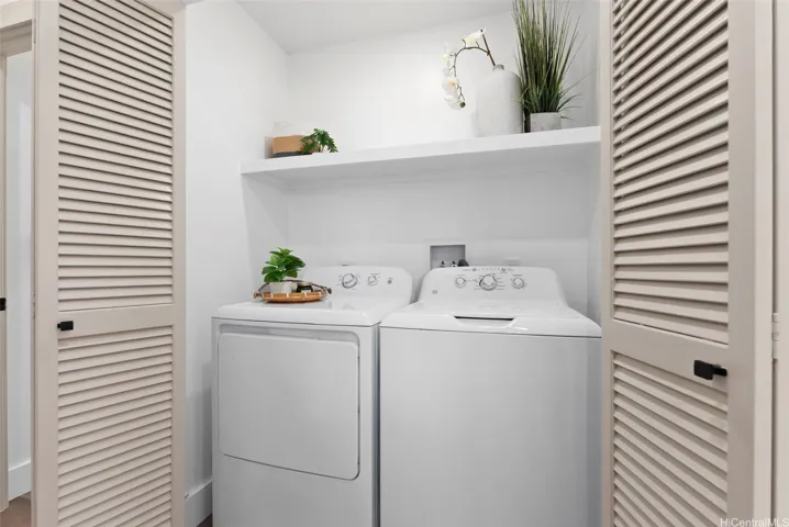Convenient interior laundry area with built-in shelving.
