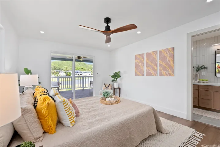 Different angle highlighting the primary suite’s private bath, deck access, and peaceful lake views.
