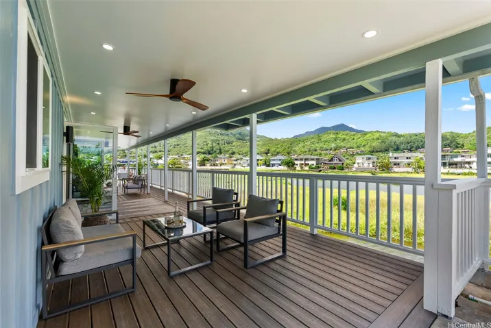 Spacious deck showcasing peaceful lake and mountain views.
