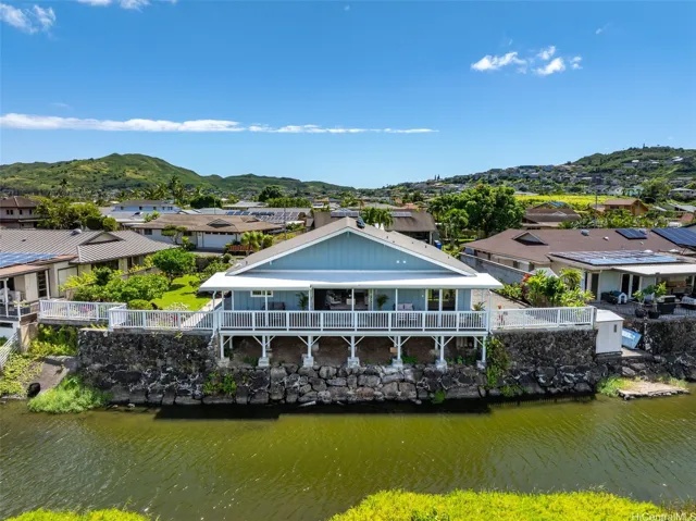 Waterfront living with an expansive deck and beautiful mountain surroundings.
