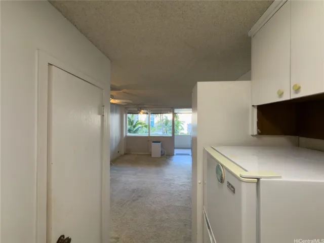 Kitchen leading to living room
