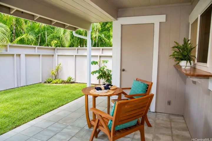 A tucked-away outdoor retreat with plenty of room to enjoy morning coffee, casual meals or a quiet afternoon at home. | Enhanced