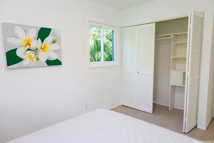 This comfortable secondary bedroom includes a generous closet and is conveniently located just steps from the hall bathroom. | Enhanced