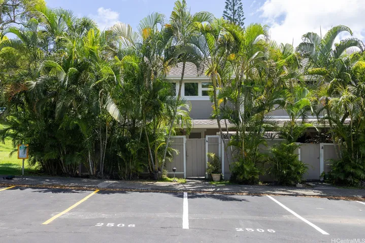 Two assigned parking stalls are conveniently located directly in front of the gated entry, with three guest parking stalls nearby for added convenience. | Enhanced