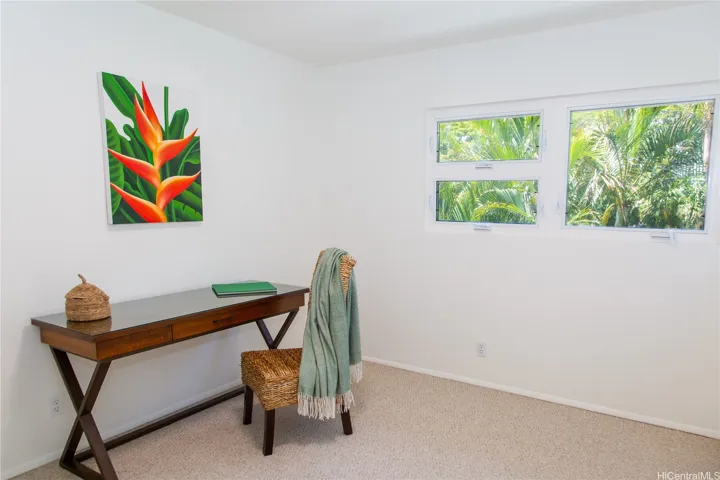 A versatile third bedroom that works equally well as a guest room, home office or flex space, with multiple windows bringing in plenty of natural light. | Enhanced