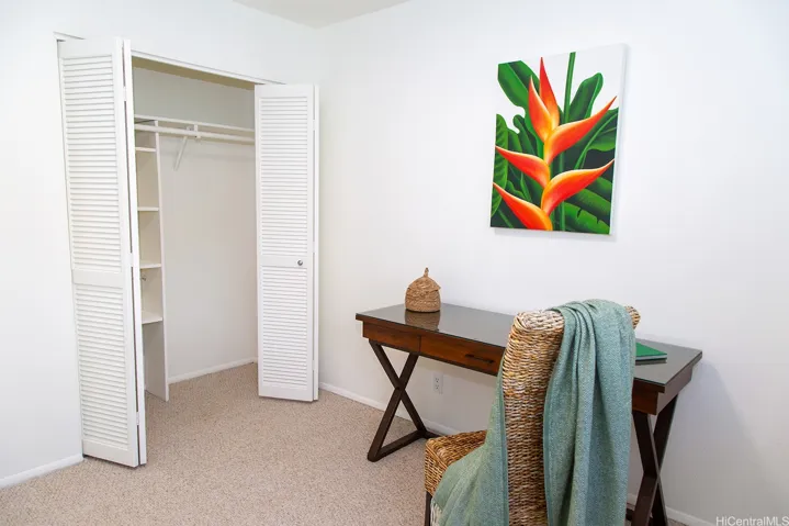 The third bedroom also offers a generous closet with built-in shelving for convenient storage and organization. | Enhanced