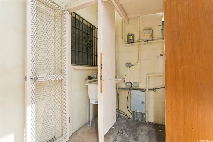 Exterior secured laundry area.