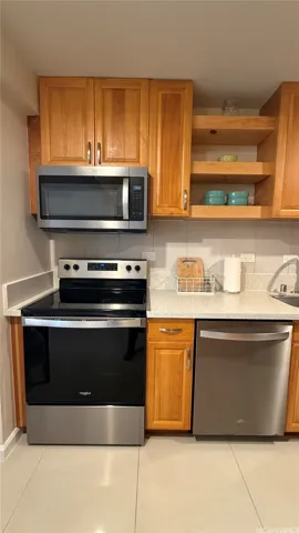 Includes dishwasher, microwave hood, range/oven