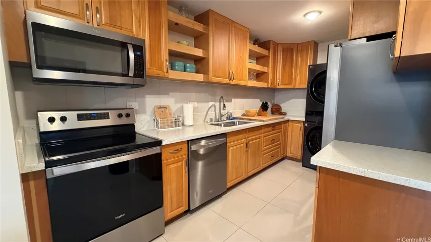 New stainless steel appliances, cabinets, counters, floors
