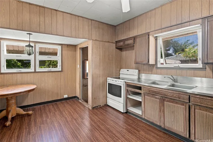 Another view of the kitchen highlighting cabinetry and workspace.