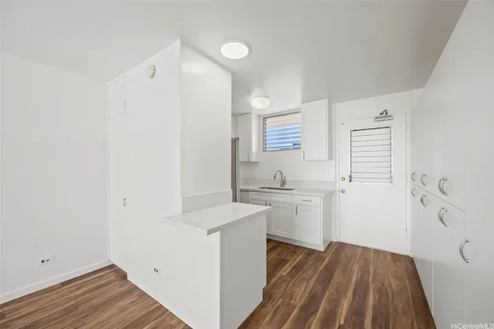 An updated kitchen with hardwood cabinetry, quartz counter tops and stainless steel appliances.  Luxury vinyl flooring runs through out.
