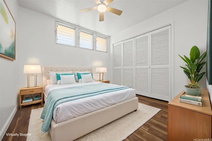 A virtually staged second bedroom with ample closet space.  Luxury vinyl flooring runs through out.