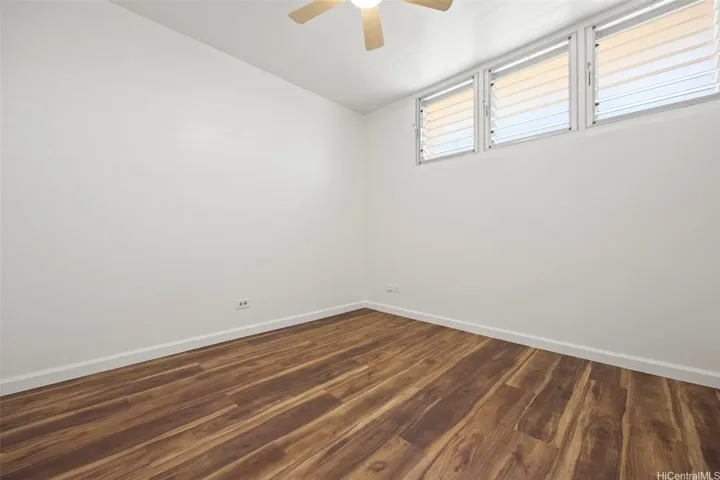 A remodeled second bedroom with ample closet space.  Luxury vinyl flooring runs through out.