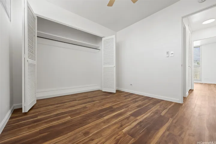 A remodeled second bedroom with ample closet space.  Luxury vinyl flooring runs through out.