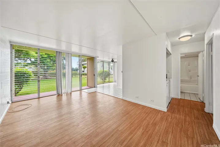 "Light & Bright" open floor-plan w/laminate wood flooring overlooking peaceful open lawn area