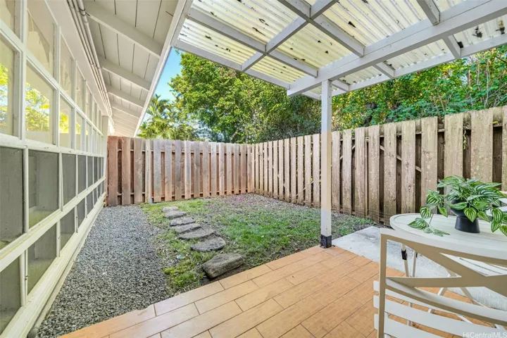 Private-entry studio courtyard with covered outdoor space.