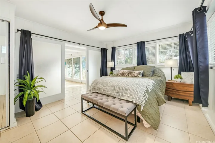 Spacious bedroom with abundant natural light.