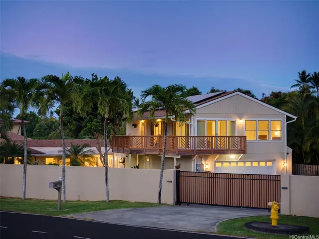 Twilight exterior showcasing expansive wraparound lanai