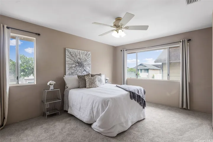 Primary bedroom with lots of natural light