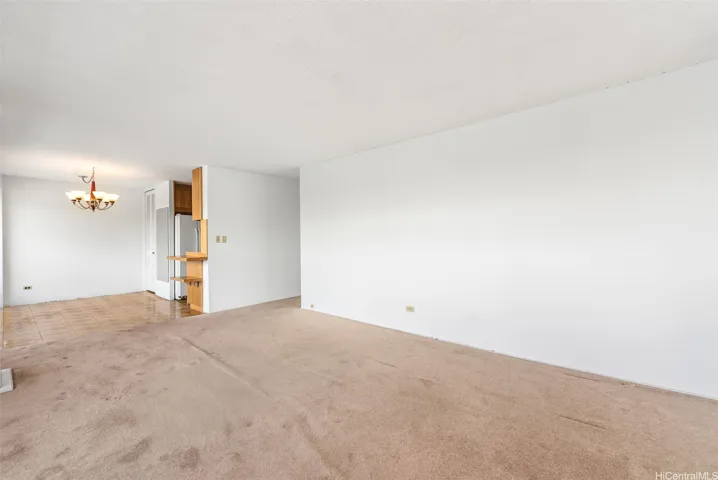 Connected living and dining areas transition back to hallway.