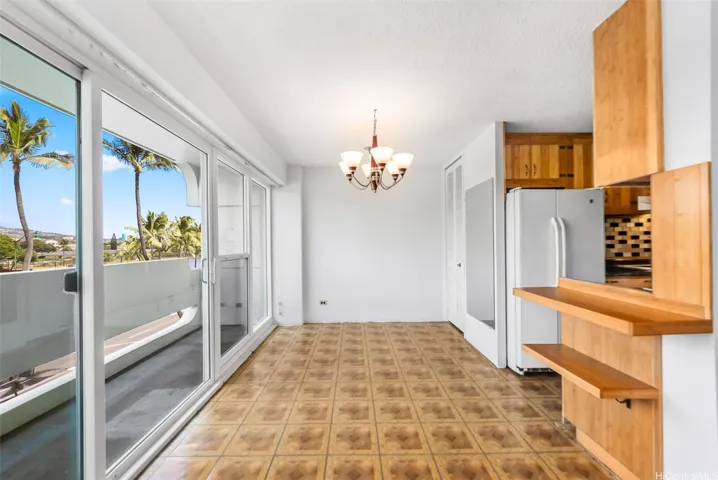 Dining area with natural light from lanai.