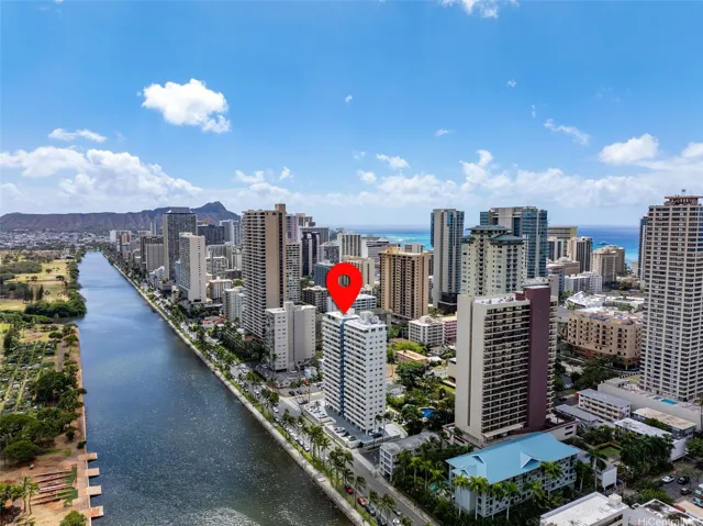 Aerial drone view of building with GPS pin with Diamond Head