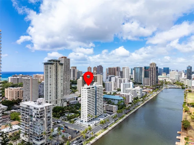 Aerial drone view of building with GPS pin