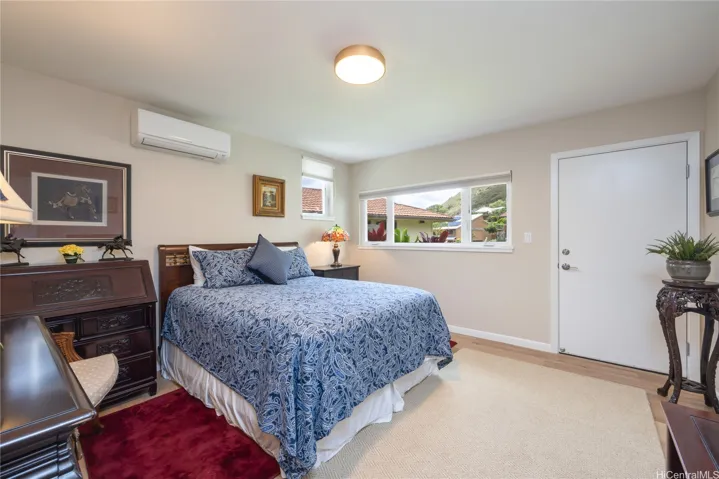The generously sized guest bedroom with a large walk-in closet, has access to the back yard.